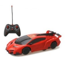 A remotely controlled car driving on the ceiling and walls, with headlights