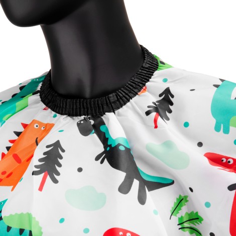 Kinderschneideumhang mit Dinosaurier-Motiven — Detailaufnahme Oberfläche