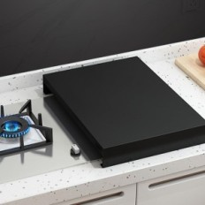 Cover for a stainless steel gas stove. Additional work space