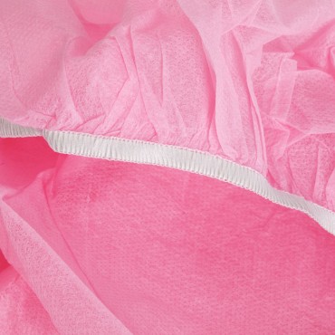 Engangs stolbetræk med elastik, 10 stk. pink — nærbillede af overflade