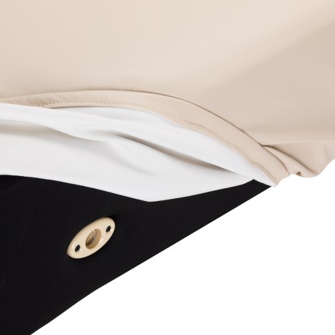 SPA-liggstol Sillon Siesta krämfärgad med ljusbrun bas — närbild av bas
