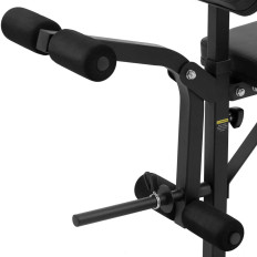 En benk av en treningsbenk under en barbell med en bønnesator justerbar til 100 kg