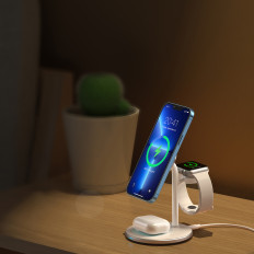 Trådlös induktionslastare med ett iPhone-stativ Apple Titta på airpods vita