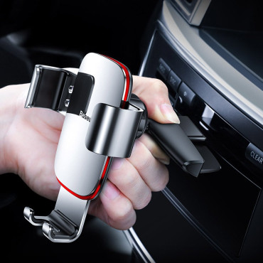 Metal car gravity handle on a black CD slot