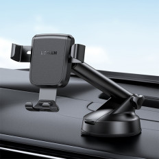 Pega gravitacional para um telefone em um painel de painel preto