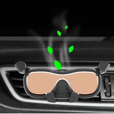 Soporte de automóvil gravitatorio para un teléfono inteligente a cuadros con un ambientador