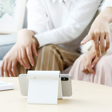 Desk adjustable stand on phone stand on white tablet