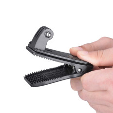 Holder with a clip for fastening a GOPRO sports camera