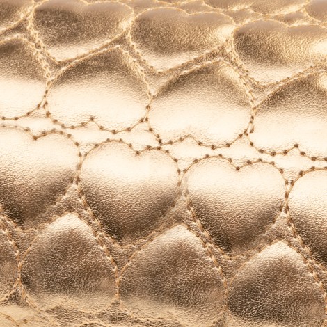 Manikúrový vankúš zlatý — detail povrchu