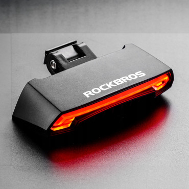 Lâmpada de bicicleta traseira com um controle remoto laser e funções de sinalização USB
