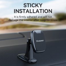 Magnetic phone holder on the dashboard in a black car