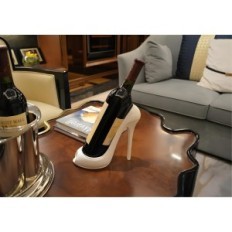 Wine stand in shape of a high-heeled white decorative bottle holder
