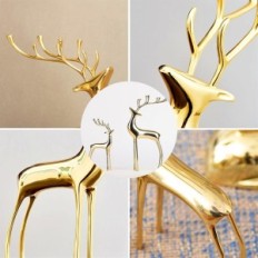 Golden figures of the reindeer of Surim elegant sculptures, a set of 2 pcs.
