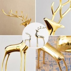 Golden figures of the reindeer of Surim elegant sculptures, a set of 2 pcs.
