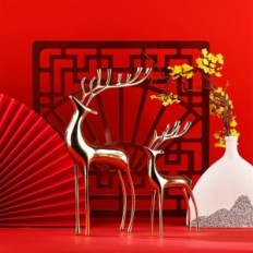 Golden figures of the reindeer of Surim elegant sculptures, a set of 2 pcs.