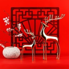 Golden figures of the reindeer of Surim elegant sculptures, a set of 2 pcs.