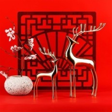 Golden figures of the reindeer of Surim elegant sculptures, a set of 2 pcs.